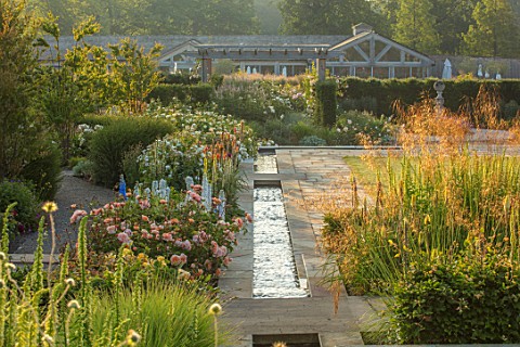 WYNYARD_HALL_COUNTY_DURHAM_WALLED_ROSE_GARDEN_STIPA_GIGANTEA_ROSES_DELPHINIUMS_RILL_WATER_HEDGES_HED