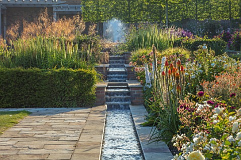 WYNYARD_HALL_COUNTY_DURHAM_WALLED_ROSE_GARDEN_BORDERS_SUMMER_JUNE_TERRACE_SLOPE_SLOPING_WATER_RILL_F
