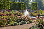 WYNYARD HALL, COUNTY DURHAM: WALLED ROSE GARDEN. BORDERS, SUMMER, JUNE, ROSES, WATER FEATURE, FOUNTAINS, POOL, POND, FORMAL, RAISED, ROSES, WOODEN TRELLIS, SUPPORTS