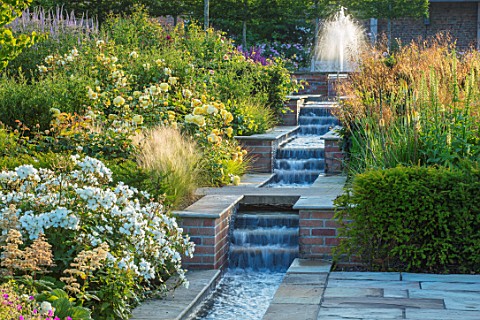 WYNYARD_HALL_COUNTY_DURHAM_WALLED_ROSE_GARDEN_BORDERS_SUMMER_JUNE_ROSES_WATER_FEATURE_RILL_SLOPES_SL