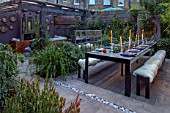 TANYA SOUTHWORTH GARDEN, LONDON, DESIGNER ANOUSHKA FEILER: TABLE, BENCHES, BAMBOOS, CONTAINERS, OUTDOOR LIVING ROOM. SOFAS, FIRE, MIRRORS, RENDERED WALL, SMALL, FORMAL, TOWN, URBAN