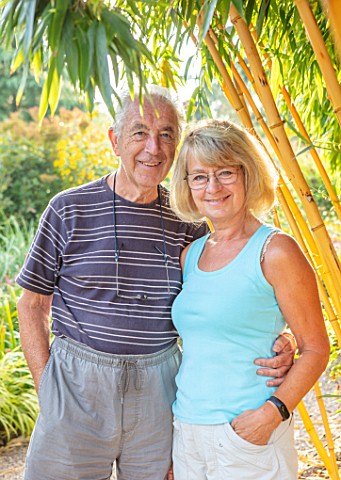 MEADOW_FARM_GARDEN_AND_NURSERY_WORCESTERSHIRE_GARDEN_OWNERS_ROB_AND_DIANE_COLE_BESIDE_PHYLLOSTACHYS_