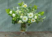 CLAUS DALBY GARDEN, DENMARK: FLOWER BOUQUET IN WHITE AND GREEN BY CLAUS DALBY IN GREY CONTAINER. DAHLIAS, NICOTIANAS, APPLES, ARRANGEMENT
