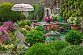 PYTTS HOUSE, OXFORDSHIRE: THE TERRACE OUTSIDE THE HOUSE, PATIO, SUMMER. PARASOL