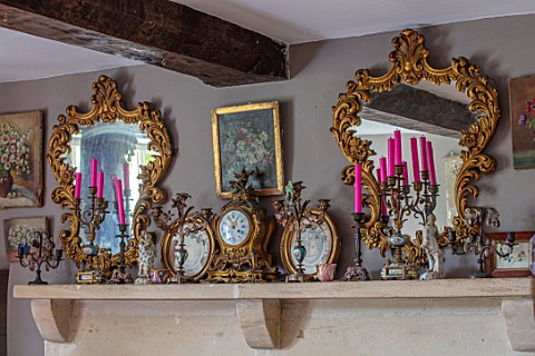PYTTS_HOUSE_OXFORDSHIRE_THE_DINING_ROOM_MIRRORS_PICTURES_CANDELABRAS_AND_CLOCKS_ON_MANTELPIECE_ABOVE