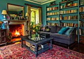 ALHAM FARM, SOMERSET: CORNISHWARE: SITTING ROOM IN PEACOCK BLUE, FIRE, BOOKCASE, VELVET SOFA, ENGLISH, COUNTRY, FARMHOUSE, TRADITIONAL