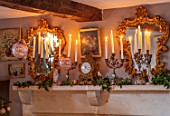 PYTTS HOUSE, OXFORDSHIRE: DINING ROOM - CANDLES, MIRRORS, CLOCK, MANTELPIECE, CHRISTMAS