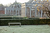 MALVERLEYS, HAMPSHIRE: WINTER, FROST, FROSTY, VEGETABLE GARDEN, POTAGER, WALLED, WALLS, FRUIT CAGE, ORNAMENTAL, FORMAL, WHITE PAINTED, BOX HEDGING, HEDGES, BENCHES