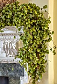 MARBURY HALL, SHROPSHIRE: DESIGNER SOFIE PATON-SMITH - DINING ROOM, VICTORIAN INSPIRED CHRISTMAS, MANTELPIECE WITH HOPS