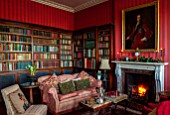 MARBURY HALL, SHROPSHIRE: DESIGNER SOFIE PATON-SMITH - THE LIBRARY, RED, FIREPLACE, CHRISTMAS
