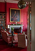 MARBURY HALL, SHROPSHIRE: DESIGNER SOFIE PATON-SMITH - THE LIBRARY, RED, FIREPLACE, CHRISTMAS