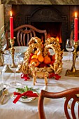 MARBURY HALL, SHROPSHIRE: DESIGNER SOFIE PATON-SMITH - TAPESTRY DINING ROOM, SWEDISH CHRISTMAS - CHRISTMAS TREE, FRESH FRUITS IN HAND MADE STRAW BASKET, CANDLES