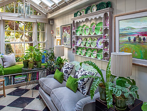 BUTTER_WAKEFIELD_HOUSE_LONDON_CHRISTMAS_GLASS_CONSERVATORY_JUST_OFF_THE_KITCHEN_WITH_SOFA_AND_BUTTER