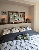 MERRYWOOD, JACKY HOBBS HOUSE, LONDON: GUEST BEDROOM IN GREY AND WHITE. PRINTED STAG PILLOWS, SILVER PIN BOARD, CANDLES
