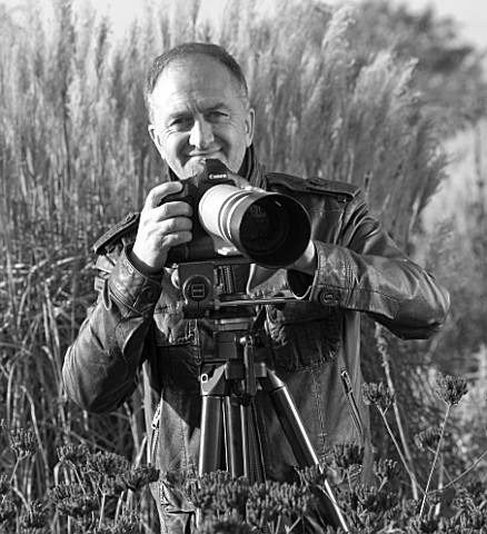 BLACK_AND_WHITE_PHOTOGRAPH_OF_CLIVE_NICHOLS_WITH_CAMERA
