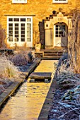 THE OLD RECTORY, QUINTON, NORTHAMPTONSHIRE: DESIGNER ANOUSHKA FEILER: RILL IN WINTER, FROST, JANUARY, GRASSES, WATER