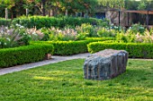TAROUDANT, MOROCCO: DESIGNERS ARNAUD MAURIERES AND ERIC OSSART: PARTERRE PLANTED WITH WHITE FLOWERS OF ICEBERG ROSES AND PENNISETUM SETACEUM. FORMAL, GARDENS, APRIL