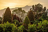 RADICEPURA GARDEN FESTIVAL, SICILY, ITALY: CLIPPED TOPIARY SHAPES WITH ETNA IN THE BACKGROUND. SUNRISE