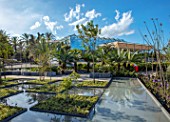 RADICEPURA GARDEN FESTIVAL, SICILY, ITALY: HOME GROUND BY ANTONIO PERAZZI. WATER GARDEN WITH TREES, WATER FEATURE, PALM TREES