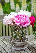 ROOKERY FARM, SURREY: PATIO, TERRACES, PATIOS, SUMMER, CONTAINER ON TABLE WITH CUT, DECORATIVE, PINK, WHITE FLOWERS OF PEONIES