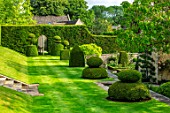 WINSON MANOR, GLOUCESTERSHIRE: LAWN, CLIPPED TOPIARY YEW, TAXUS, SUMMER, ENGLISH, COUNTRY, GARDENS, GRASS, TERRACE