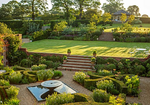 MANOR_FARM_CHESHIRE_VIEW_ONTO_FORMAL_HERB_GARDEN__STEPS_GRAVEL_WATER_FEATURE_BOX_HEDGES_HEDGING_AMSO