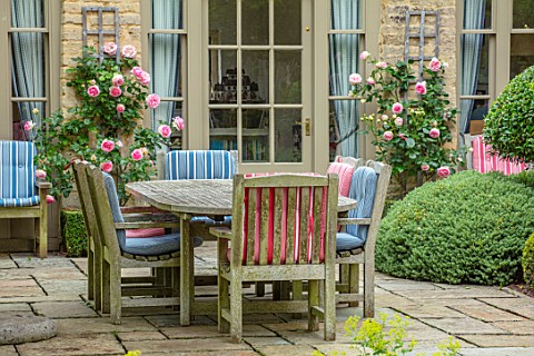WINSON_MANOR_GLOUCESTERSHIRE_PATIO_TERRACE_SUMMER_TABLE_CHAIRS_CUSHIONS_ENTERTAINING_DINING_ROSES