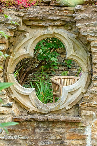 ADAMS_POOL_GLOUCESTERSHIRE_FOLLY_WALL_WITH_QUATREFOIL_RECYCLED_CHURCH_WINDOW