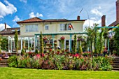 WATERDALE, WEST MIDLANDS - THE BACK OF THE HOUSE - LAWN, RED BORDER, BLUE PERGOLA, STEPS, CONSERVATORY