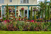 WATERDALE, WEST MIDLANDS - THE BACK OF THE HOUSE - LAWN, RED BORDER, BLUE PERGOLA