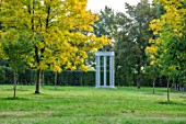 MORTON HALL, WORCESTERSHIRE: MONOPTEROS IN PARK, YELLOW LEAVES OF TREES - FRAXINUS EXCELSIOR JASPIDEA, TREES, OCTOBER, FALL, AUTUMN