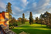 MORTON HALL GARDENS, WORCESTERSHIRE: LAWN, MEADOW, PARKLAND FROM ROOF OF HALL. SEQUOIADENDRON GIGANTEUM, WELLINGTONIA, GIANT SEQUOIA, GIANT REDWOOD, CONIFERS