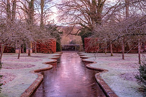 BRYANS_GROUND_HEREFORDSHIRE__WINTER_GARDEN_FROST_FROSTY_SERPENTINE_CANAL_JANUARY_FRUIT_TREES_HEDGE_H