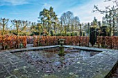 BRYANS GROUND, HEREFORDSHIRE: FROZEN POOL, POND, CONTAINER, STONE, URN, BEECH, HEDGES, HEDGING, WINTER, COUNTRY GARDEN, FROST, FROSTY, VIEW, FOCAL POINT