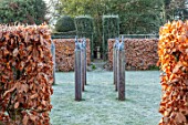 BRYANS GROUND, HEREFORDSHIRE: SQUARE OF HARE SCULPTURE, FROST, FROSTY, WINTER, JANUARY, GARDEN, ORNAMENT, FORMAL, HEDGING, HEDGES, BEECH