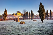 CHIPPENHAM PARK, CAMBRIDGESHIRE: THE WALLED GARDEN, BEECH HEDGES, STANDING STONES, FROSTED LAWN, WINTER, JANUARY, FROSTY, DAWN, SUNRISE