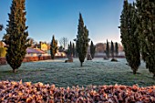 CHIPPENHAM PARK, CAMBRIDGESHIRE: THE WALLED GARDEN, BEECH HEDGES, STANDING STONES, FROSTED LAWN, WINTER, JANUARY, FROSTY, DAWN, SUNRISE