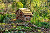 THE PICTON GARDEN AND OLD COURT NURSERIES, WORCESTERSHIRE: MARCH, SPRING, BUG HOUSE, INSECT HOUSE, SHADE, SHADY, WOODLAND, INSECT HOTEL, WILDLIFE