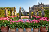ARUNDEL CASTLE GARDENS, WEST SUSSEX: COLLECTOR EARLS GARDEN, TERRACOTTA CONTAINERS WITH TULIP PINK IMPRESSION, WATERFALL, FOUNTAIN, FOLLY, FOLLIES