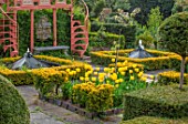 THE LASKETT GARDENS, HEREFORDSHIRE. DESIGNER ROY STRONG - THE HOWDAH COURT, MALUS FLORIBUNDA, CLIPPED TOPIARY, FORMAL GARDEN, APRIL, SPRING, VIEWING PLATFORM, WATER FEATURES