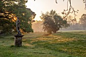 FORDE ABBEY, SOMERSET: STATUE AND LANDSCAPE AT DAWN, MORNING LIGHT, SUNRISE, APRIL, SPRING