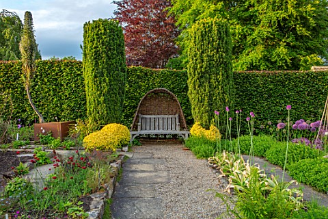 YORK_GATE_YORKSHIRE_HERB_GARDEN_JUNE_SUMMER_CLIPPED_TOPIARY_HEDGES_COLUMNS_WOODEN_BENCH_SEAT_WOVEN_W