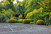 YORK GATE, YORKSHIRE: CIRCULAR PAVEMENT MAZE, STONE SETTS, GRAVEL, DRIVE, CLIPPED TOPIARY YEWS, TAXUS, YUCCAS, FRONT GARDEN, JUNE, SUMMER