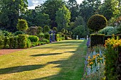 THENFORD, NORTHAMPTONSHIRE: LONG HERBACEOUS BORDER, SUMMER, BORDERS, LAWN, GRASS, CLIPPED, TOPIARY, YEW, HEDGES, HEDGING, WALLS