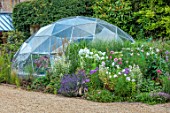 THE MANOR HOUSE, STEVINGTON, BEDFORDSHIRE. DESIGNER: KATHY BROWN - THE GEODESIC DOME BESIDE DRIVE, LAVENDER, PHLOX, DAHLIAS, MISCANTHUS, BORDERS