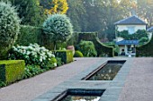 THE OLD VICARAGE, WORMINGFORD, ESSEX: DESIGNER JEREMY ALLEN - RILL GARDEN, WATER, PYRUS SALICIFOLIA, BUXUS, HYDRANGEA ANNABELLE, HOUSE, HEDGES, HEDGING