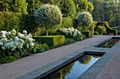 THE OLD VICARAGE, WORMINGFORD, ESSEX: DESIGNER JEREMY ALLEN - RILL GARDEN, WATER, PYRUS SALICIFOLIA, BUXUS, HYDRANGEA ANNABELLE, SEAT, BENCH, WOODEN PERGOLA, HEDGES, HEDGING