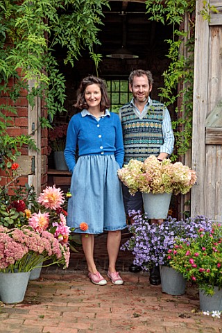THE_FLOWER_GARDEN_AT_STOKESAY_COURT_BARNEY_AND_MARTIN_BESIDE_THE_POTTING_SHED_WITH_DAHLIAS_ASTERS_AN
