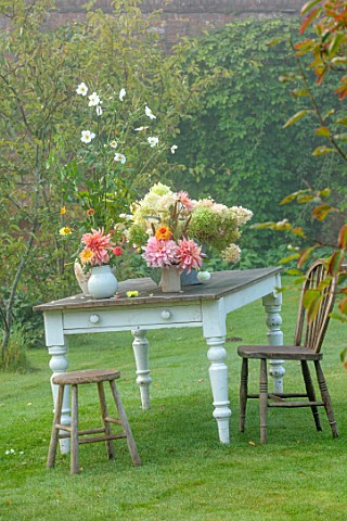 THE_FLOWER_GARDEN_AT_STOKESAY_COURT__LAWN_AMELANCHIER_TABLE_CONTAINERS_DAHLIAS_PENHILL_WATERMELON_PR