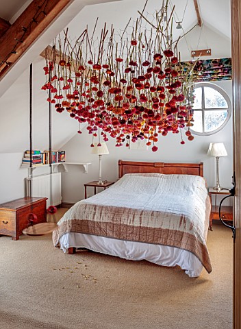JUST_DAHLIAS_CHESHIRE_BEDROOM_WITH_DAHLIA_INSTALLATION_ABOVE_BED_BY_PHILIPPA_STEWART